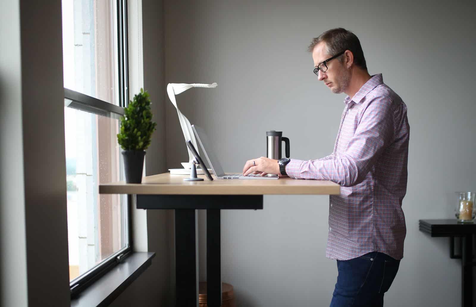 Is it better to sit or stand at a desk?