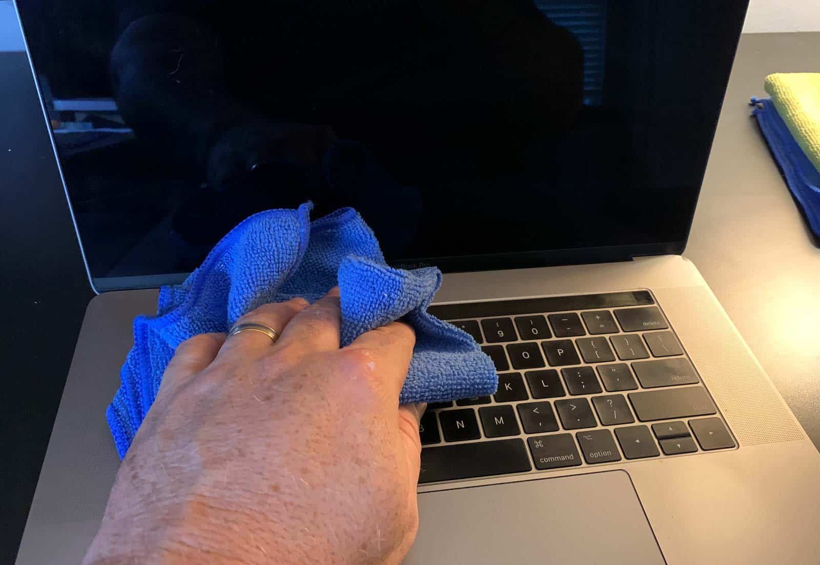 Use disinfectant wipes to clean the keyboard surface